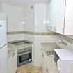 Apartment 110 kitchen with pass-through window to living room (Playa Dorada Las Palmas Canteras)